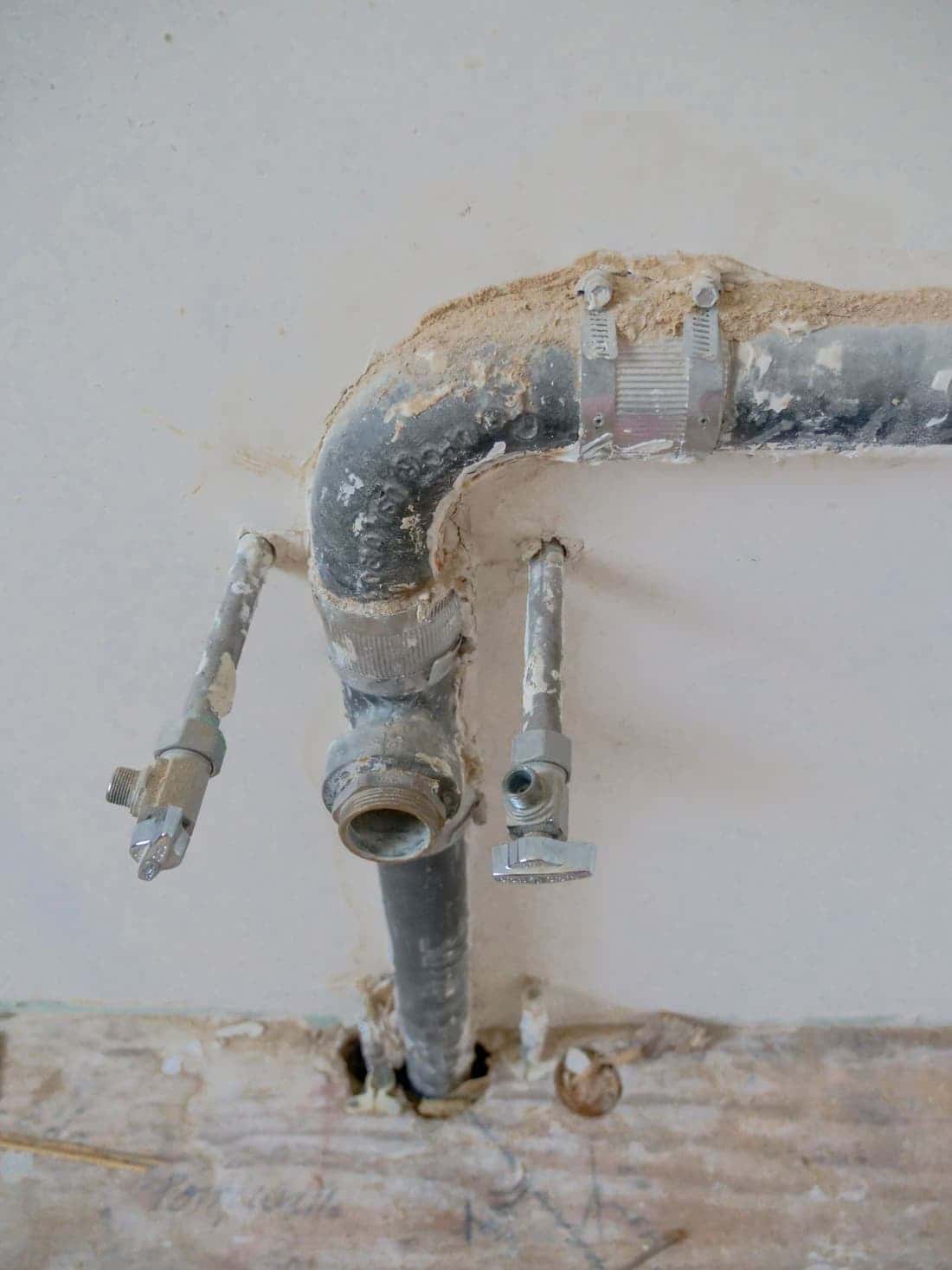 Old galvanized pipes on a wall