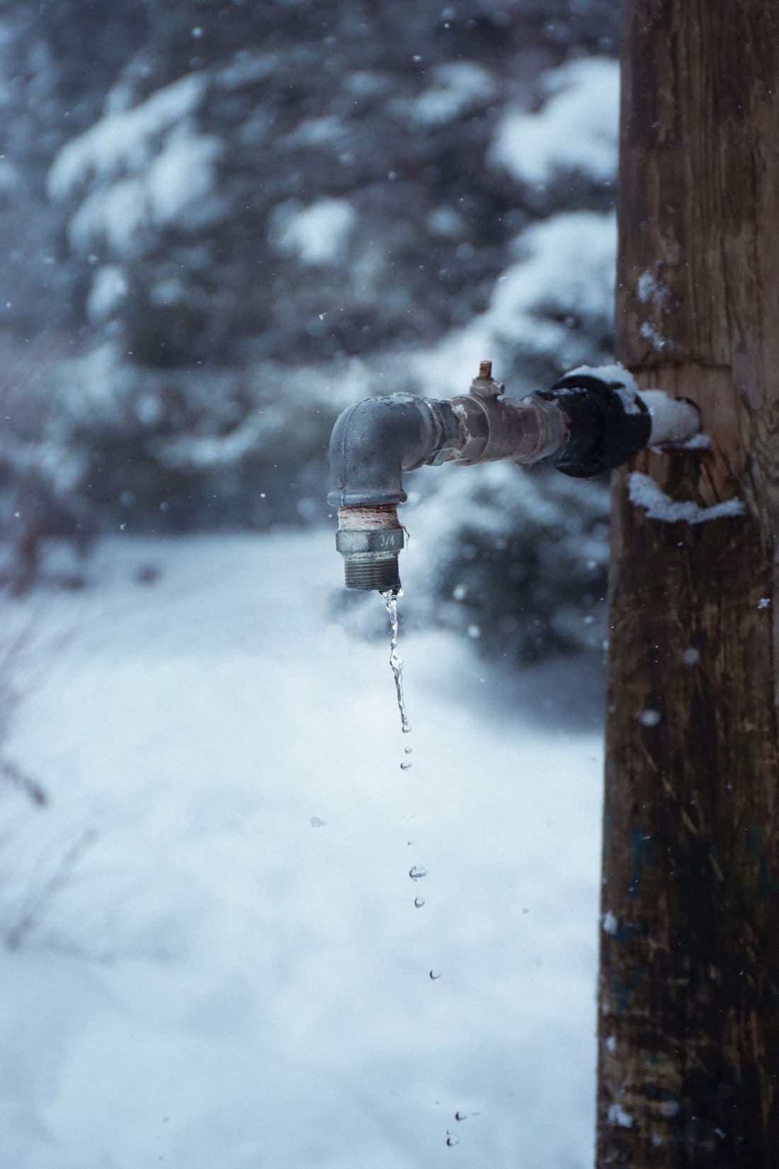 Frozen outdoor faucet with icicles