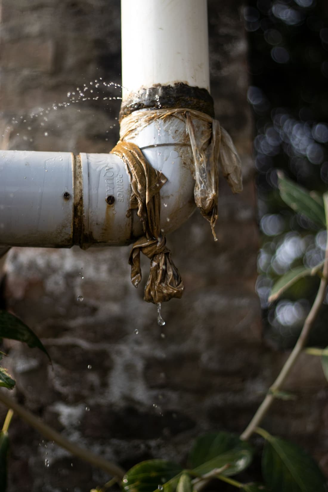 Leaking pipe with a temporary patch