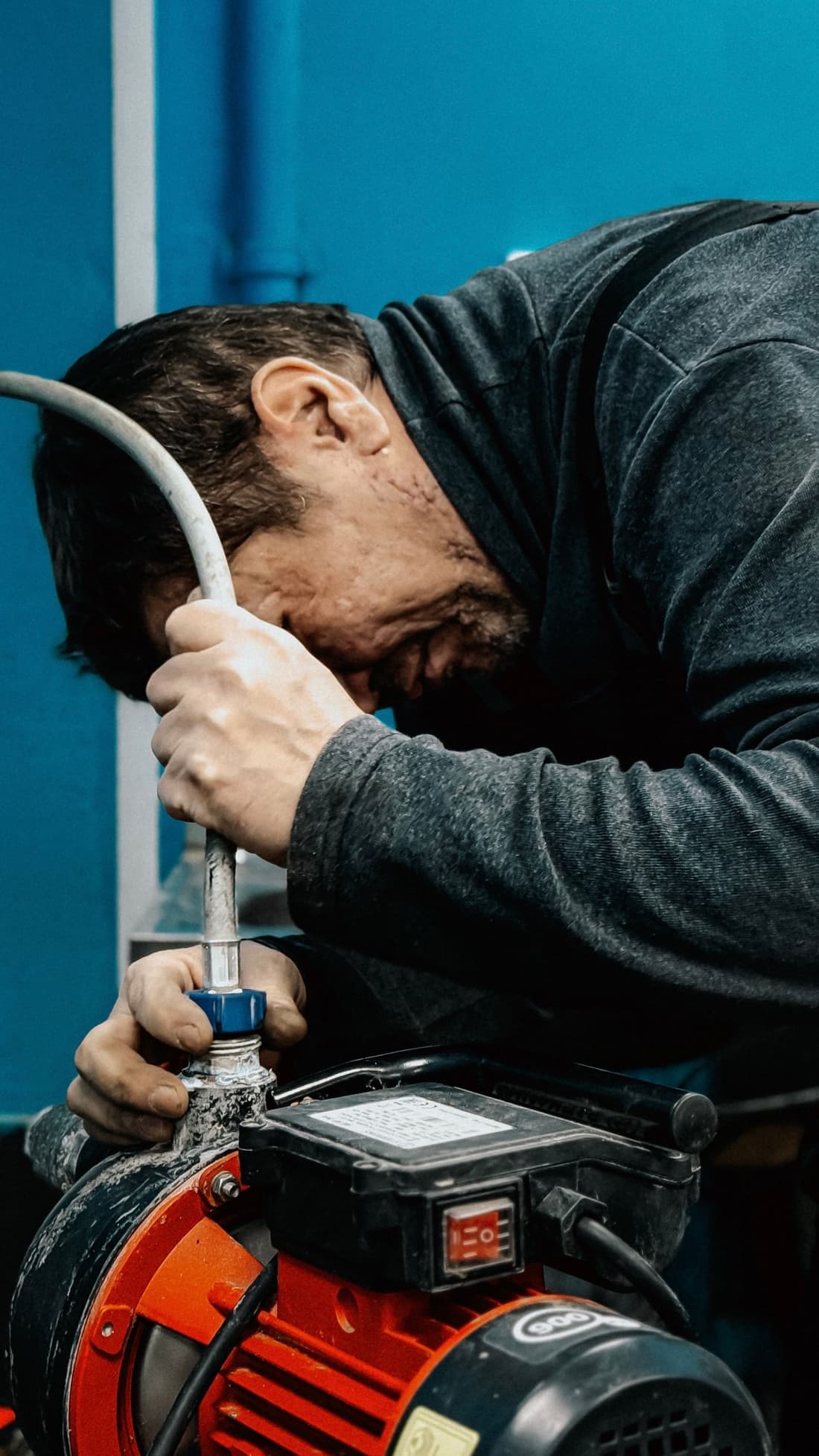 Technician servicing a water pump